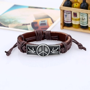 Vintage dark brown braided leather bracelet with silver peace sign and bird metal accent