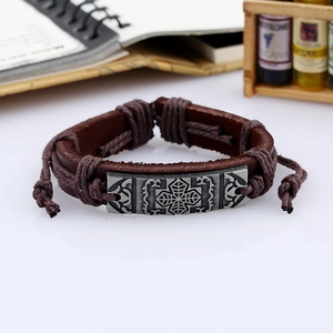 Retro hand-woven brown leather bracelet featuring an engraved silver cross star metal plate