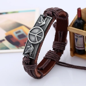 Vintage brown braided leather bracelet with silver peace sign and dove engraved metal plate