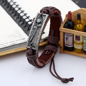 Vintage brown leather woven bracelet with silver rose metal plate in punk style