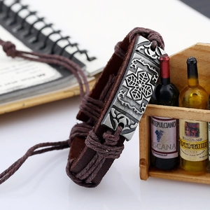 Retro wide dark brown leather bracelet with embossed metal plate and braided cords