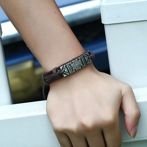 Handmade vintage brown leather woven bracelet with engraved silver cross floral metal charm