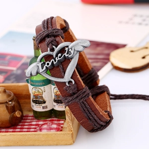 Vintage braided leather bracelet with heart wings charm and adjustable cord strap