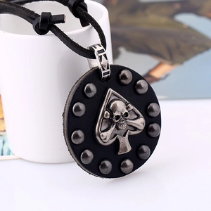 Vintage punk leather necklace featuring silver-toned skull emblem on black round pendant