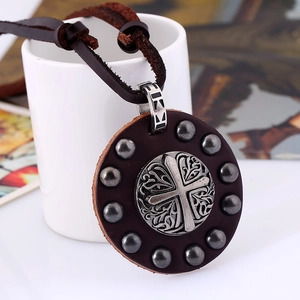 Vintage punk style leather necklace featuring a silver cross pendant and metal rivets