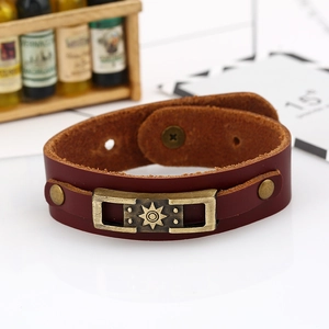 Retro brown cowhide leather bracelet featuring a bronze sunburst metal charm and snap button