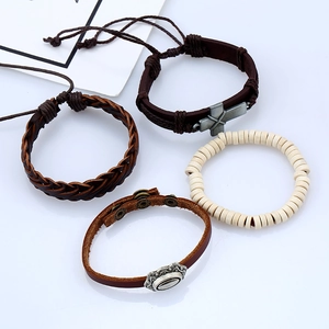 Handmade vintage leather bracelet set with four unique braided and metal cross charms