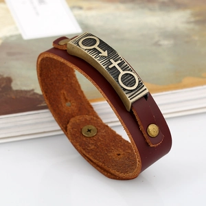 Vintage reddish brown leather couple bracelet with brass male and female gender symbols