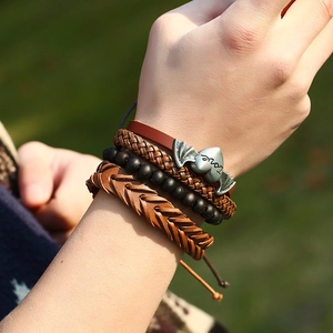 Multilayer leather bracelet set with bat heart metal charm on a vintage woven cord