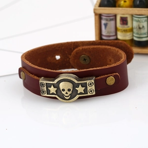 Retro brown cowhide leather wristband featuring bronze skull and star metal ornament