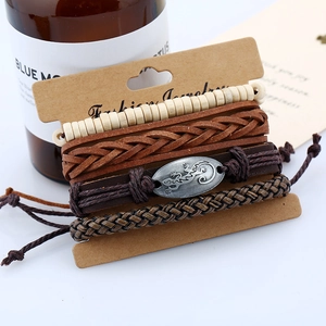 Set of 4 vintage leather bracelets featuring a silver gecko charm and woven hemp cord