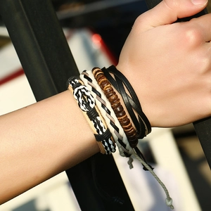 Men's multi-layer leather wrap bracelet set featuring braided cord and wooden beads