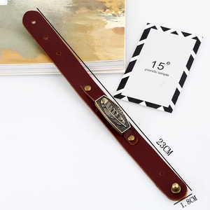 Retro burgundy leather bracelet with bronze feather charm and dimension marks