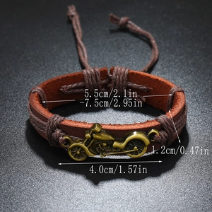 Vintage braided leather bracelet featuring a bronze motorcycle charm in punk style