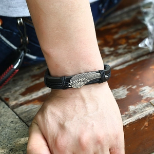 Handmade woven leather wing bracelet for men and women with vintage silver wing charm