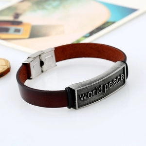 Bracelet vintage en cuir marron avec plaque métallique gravée motif World Peace