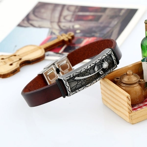 Vintage brown leather bracelet with rose engraved stainless steel plate in artistic setting