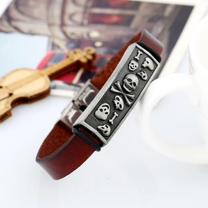 Vintage brown leather skull bracelet for men with embossed punk style metal clasp detail
