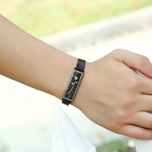 Vintage leather bracelet for men with embossed rose motif on stainless steel plaque
