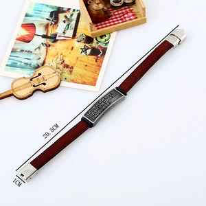 Detail view of vintage brown leather bracelet with silver plaque showing 20.5cm length