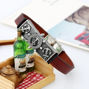 Vintage nautical leather bracelet featuring antique silver anchor and rudder alloy charm