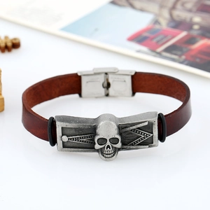 Retro brown leather bracelet featuring a silver skull charm with stainless steel clasp