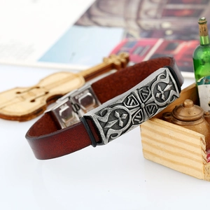 Vintage brown leather bracelet with embossed silver cross and stainless steel clasp