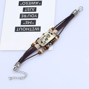 Multilayer leather bracelet with bronze Love charm and beads in bohemian vintage style