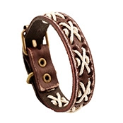 Macro detail of brown leather multilayer bracelet with white cross-stitch weave and bronze buckle