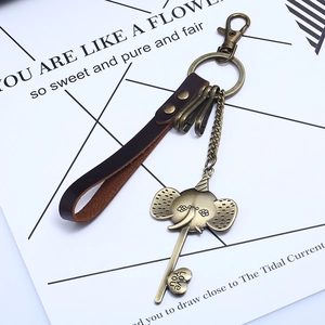 Vintage leather elephant keychain with bronze heart pendant and Love You engraving