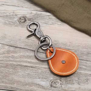 Retro cross leather keychain with orange teardrop pendant and vintage metal lobster clasp