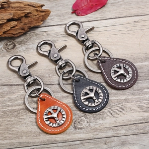 Vintage leather keychain set with metal peace sign and handmade stitching details