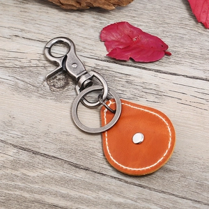 Retro punk style leather keychain with orange teardrop pendant and antique silver hook