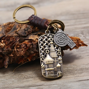Retro handmade woven leather keychain with bronze cathedral pendant and engraved tag