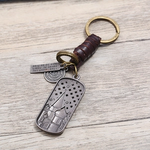 Vintage handmade leather keychain featuring Russian cathedral architecture and carved quote