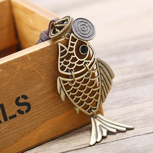 Handcrafted vintage hollow bronze fish pendant with genuine leather strap and metallic rings