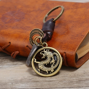 Vintage bronze dragon keychain with genuine leather wrap and engraved key pendant