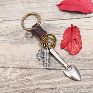 Retro handmade leather keychain with vintage silver metal shovel and heart-felt pendant