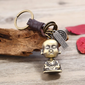 Retro monk brass keychain with hand-woven leather strap and antique metal finish charms