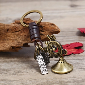 Steampunk handmade leather car keychain with brass bell and engraved gear charm