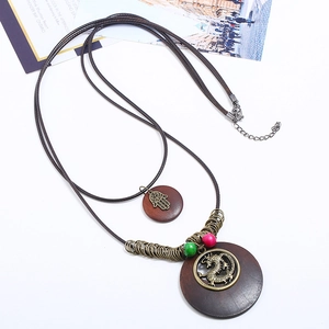 Vintage bronze dragon necklace with double layered wood pendants on long brown leather cord