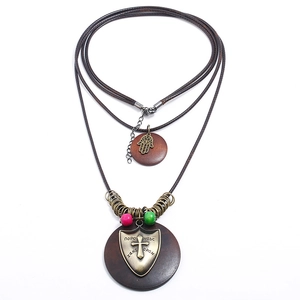 Vintage multi-layer sweater necklace with wood pendants and Fatima hand metal charms