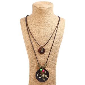 Vintage layered sweater necklace with Fatima hand and scissors charms on wooden pendants