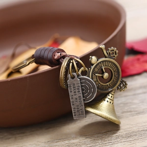 Retro handmade leather keychain with steampunk gear and horn charms for car keys