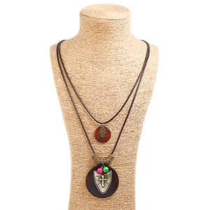 Vintage double-layer long necklace with Hamsa hand, cross, and brown wood pendants