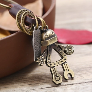 Vintage industrial robot keychain made of bronze alloy and woven brown leather strap