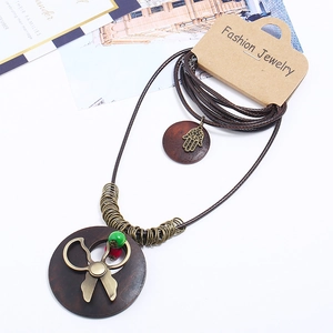 Vintage multi-layer sweater necklace with bronze pendants and colorful beads on wax rope