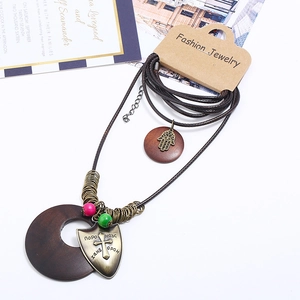 Vintage multi-layer leather necklace with wooden ring and bronze hand of fatima pendant