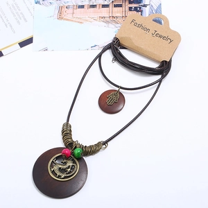 Vintage long bronze dragon necklace with wooden pendant and woven cord sweater chain