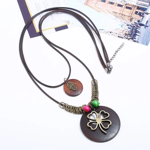Bohemian double-layer long sweater necklace with bronze clover and hand of fatima wood pendant